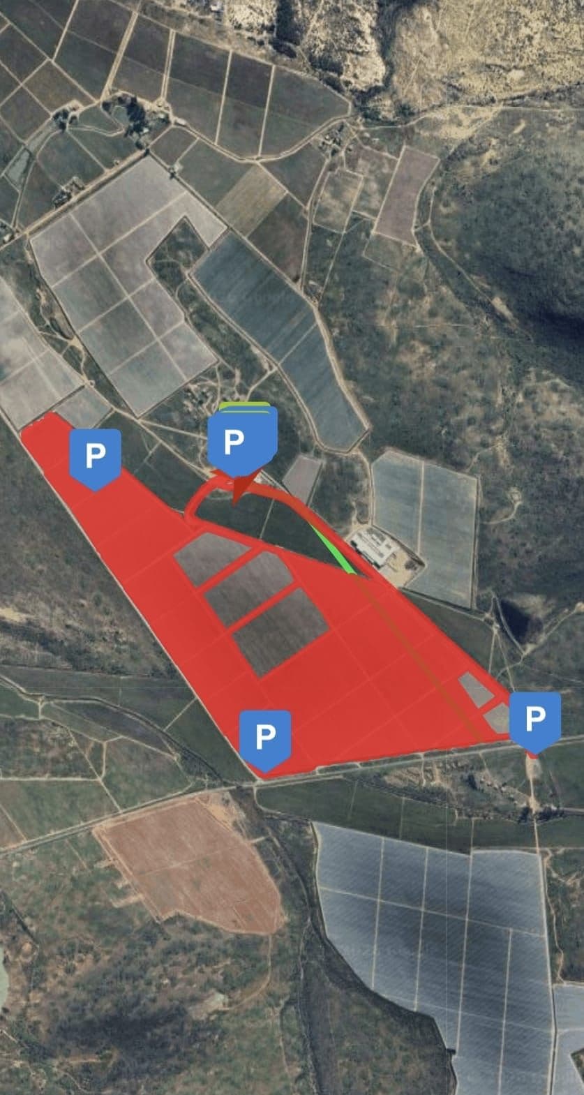 GPS coverage map showing the area sprayed on a recent Langeberg job, overlaid in red on satellite imagery with parking-spot markers.